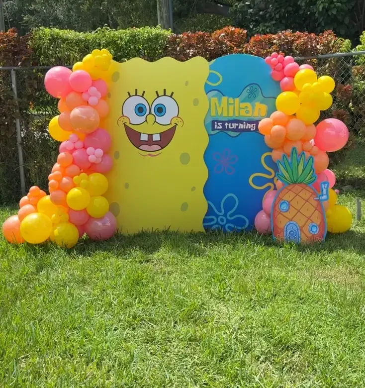 SpongeBob themed kids birthday balloon arch with custom name sign